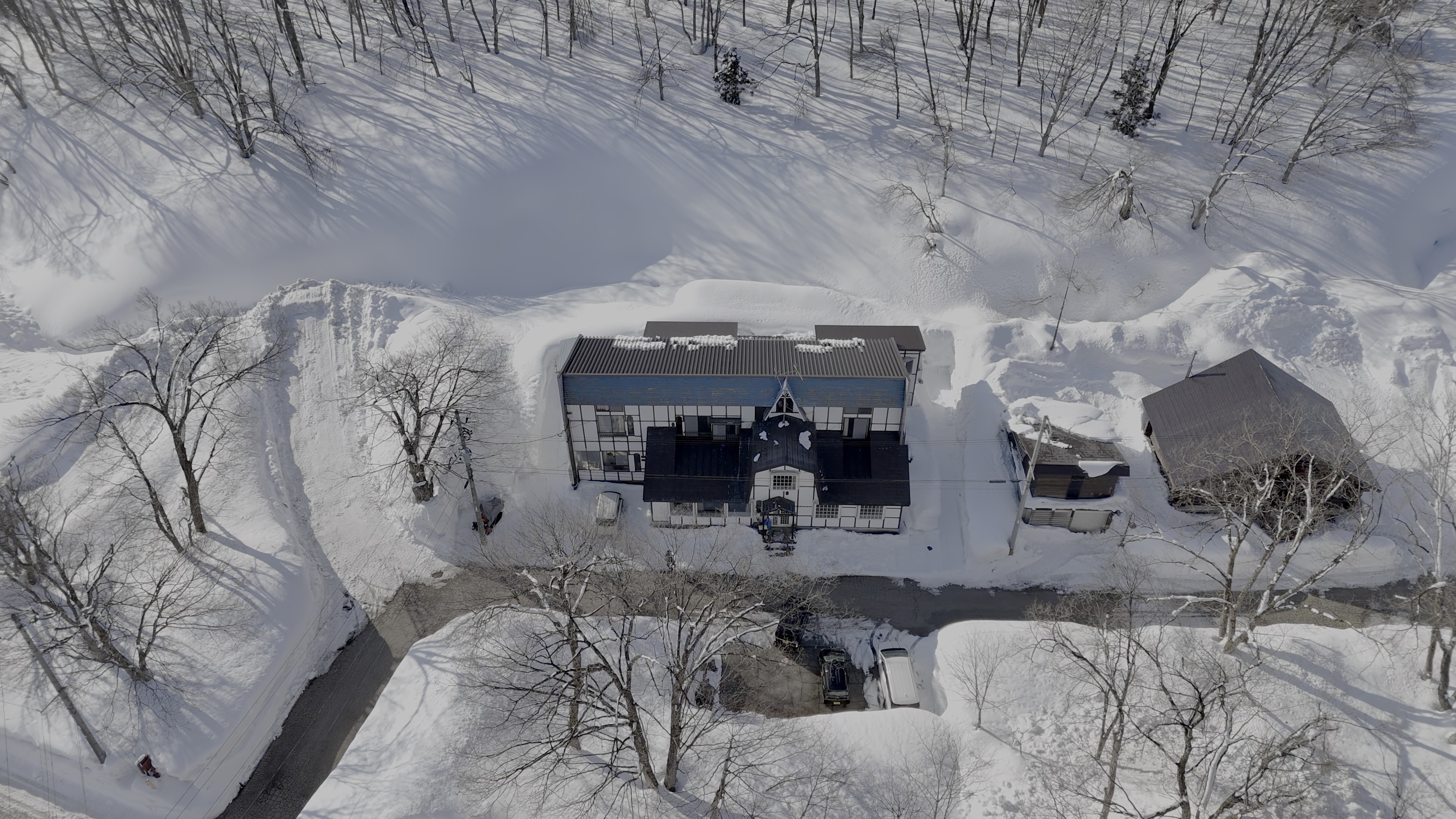 Aerial view of Melo Haus chalet in winter