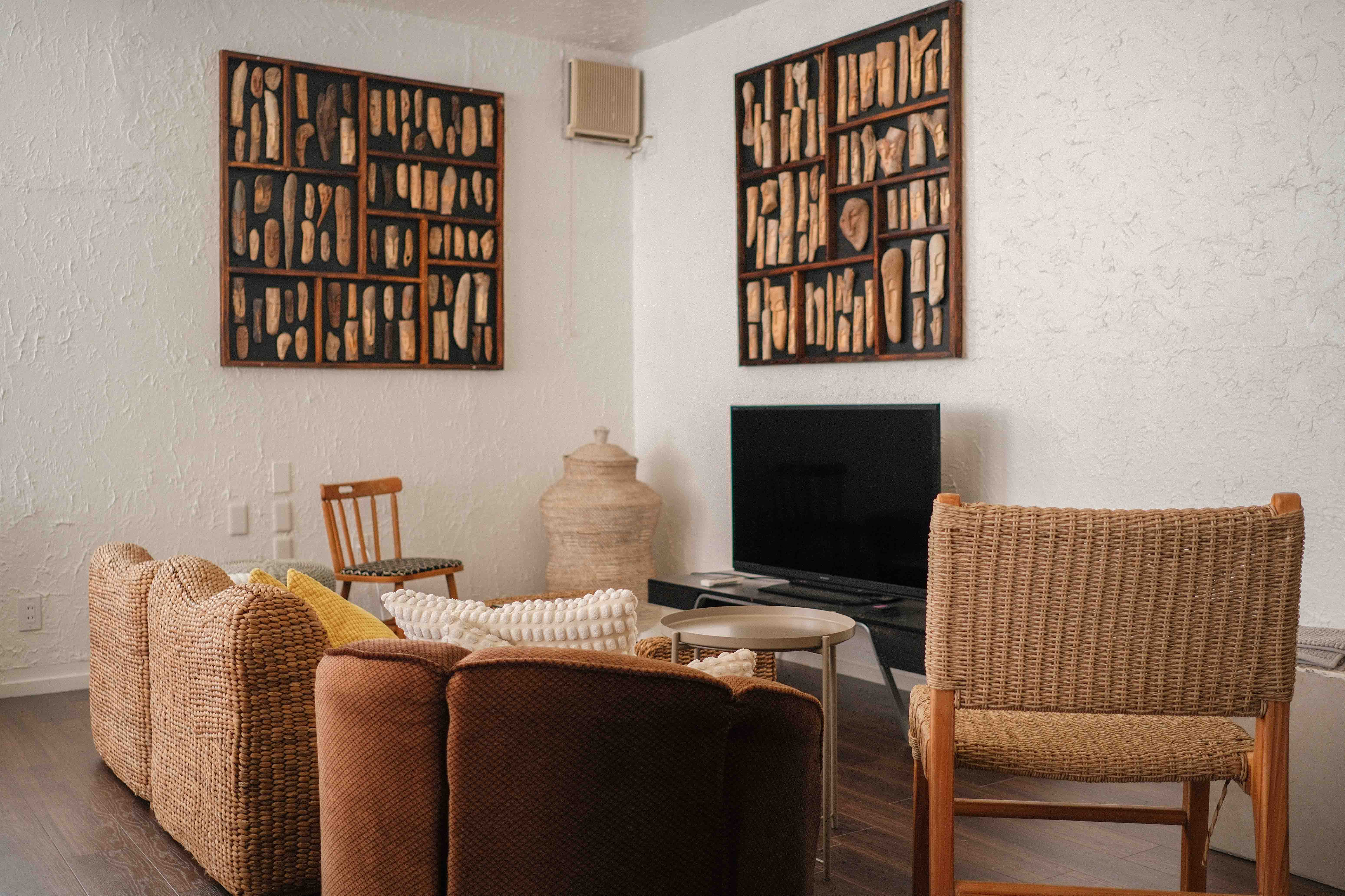 Lounge with driftwood art and rattan furniture